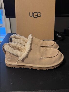 UGG Slip-On woman’s Shearling Lined Shoe in Sand color.